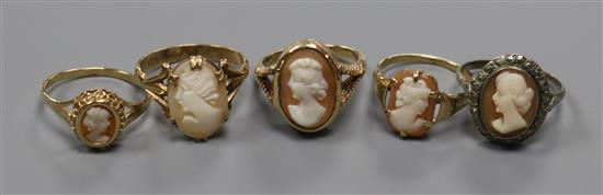 Four assorted 9ct gold and oval cameo set dress rings and a white metal and cameo ring.